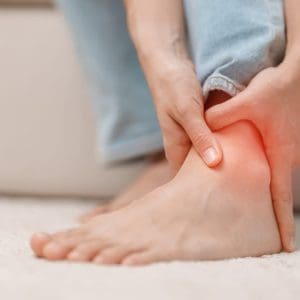woman having leg pain due to Ankle Sprains or Achilles Tendoniti woman having leg pain due to Ankle Sprains or Achilles Tendonitis and Shin Splints ache. injuries, health and medical concept